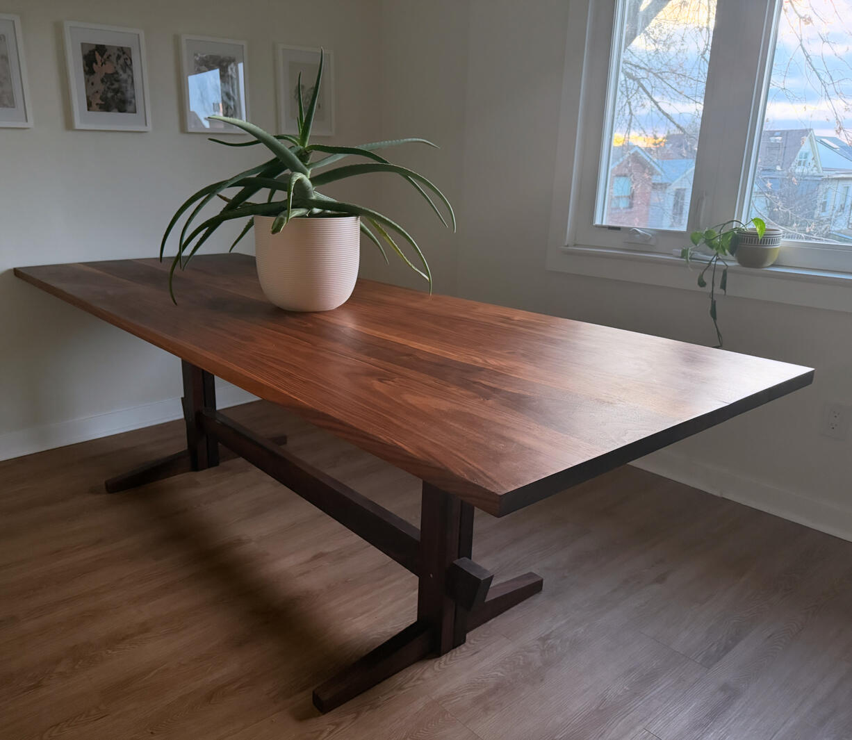 One of my proudest designs, The Maltz Table. Solid Walnut trestle dining table. The Aloe Vera makes it seem small, but it actually seats 10 (that Aloe Vera is huge).